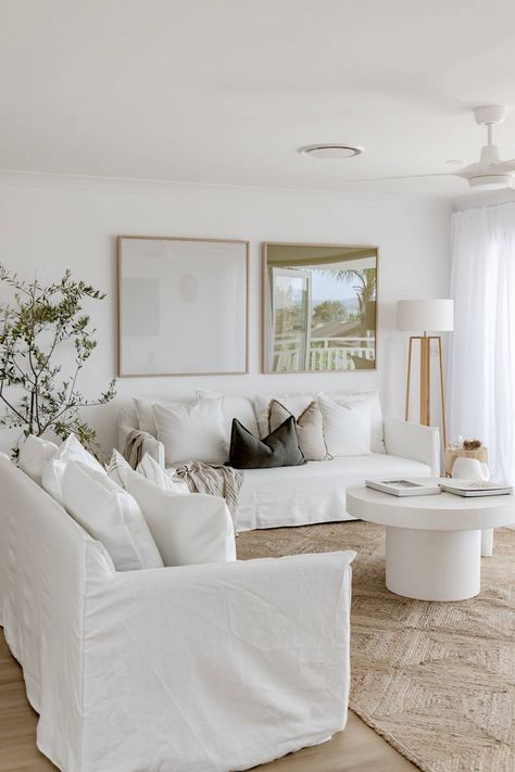 These Living Rooms Will Inspire You to Take the Plunge on a Winter White Sofa White Couch Interior Design, Coastal White Living Room, White Sofa With Rug, Lounge Room Art, Large Lamps Living Room, Large Lounge Room Ideas, White Table Lamp Living Room, Open Wall Decor Living Room, White Couches Living Room Decor