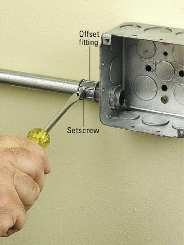 How to Install Metal Conduit | Better Homes & Gardens Electrical Conduit Ideas, Conduit Lighting, Electric Installation, Ceiling Outlet, Conduit Bending, Rustic Wall Lighting, Home Electrical Wiring, Electrical Conduit, House Wiring