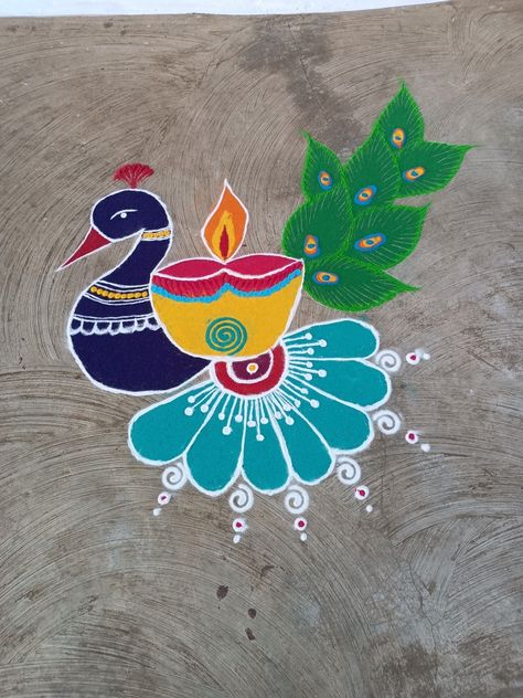 Peacock And Diya Rangoli, Rangoli In Front Of Door, Best Rangoli Designs Diwali Peacock, Fancy Rangoli Designs, Rangoli Designs Peacock Easy, Simple Peacock Rangoli Designs Easy, Peacock Rangoli Easy, Pecock Model Rangoli, Cartoon Rangoli Designs Easy