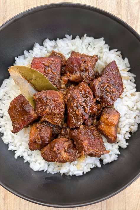 tender filipino pork belly adobo with soy sauce, vinegar, pepper, and bay leaves over a bowl of white rice Filipino Pork Adobo, Pork Adobo Recipe, Filipino Rice, Ground Beef And Cabbage, Pork Adobo, Adobo Recipe, Ground Beef Pasta, Braised Pork Belly, Beef Pasta