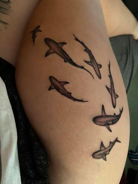 Get ready to dive into the world of shark tattoos and discover their unique symbolism and style. We invite you to learn more about their meaning, as well as choose a design that's right for you. Shark Tattoo On Calf, 95 Tattoo Number, Shark Thigh Tattoo, Shark Tattoo Thigh, Shark Hip Tattoo, Shark Leg Tattoo, Sea Life Tattoos For Women, Sea Inspired Tattoos, Pretty Thigh Tattoos