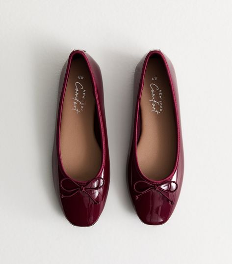 New Look Burgundy Patent Leather-Look Ballerina Pumps. An easy everyday staple, these pared-back ballet flats are shaped from smooth leather-look material with a. Comfort insole for a secure, comfortable fit. Material: patent leather-look finish Fit: standard Shoe Style: ballet flat Colour: burgundy Fastening: slip on Design: round toe, bow embellishments, bound edges . Comfort: a range of styles designed with features such as cushioned padding, softer linings and flexible soles. Red Dress Boots, Burgundy Ballet Flats, Bow Embellishments, Ballerina Style, Burgundy Jeans, Ballerina Pumps, Burgundy Shoes, Wedding Guest Shoes, January 2023