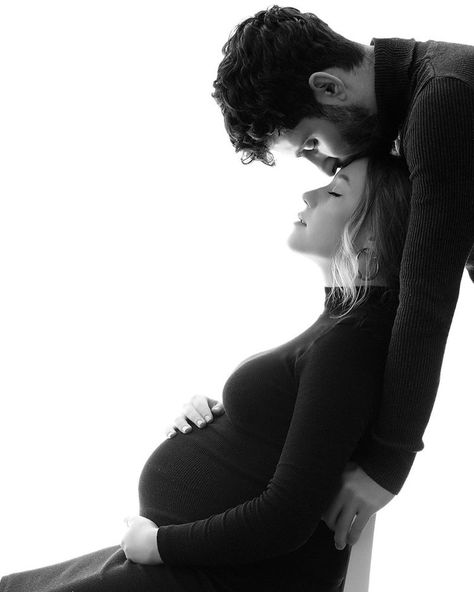 Posing For Pictures While Pregnant, Maternity Shoot In Black Dress, Maternity Shoot Black Dress Couple, Maternity Shots With Husband, Black Maternity Dress Photoshoot Couple, Pregnant Winter Photoshoot, Maternity Photo Shoot Black Dress, Maternity Photo Black Dress, Classy Maternity Photos