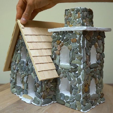 Making A Realistic Stone Miniature House | house, rock | Making A Realistic Stone Miniature House | By DIY & Crafts | Facebook Pebble House, Stone Miniature, Christmas Tree Village Display, Stone Cabin, Cabin Crafts, Christmas Tree Village, Fairy Tree Houses, House Craft, Nature Craft