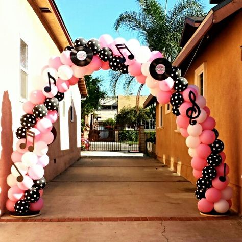 50's themed balloon arch...Arch is bout 8-9ft high. Used Pink, White & Black Polka Dot balloons. 50s Hoco Theme, 50s Theme Balloon Arch, Sock Hop Balloon Arch, 50s Balloon Arch, 50s Balloon Decor, 50s Homecoming Theme, Grease Themed Wedding, Retro Balloon Arch, Rock And Roll Balloon Arch