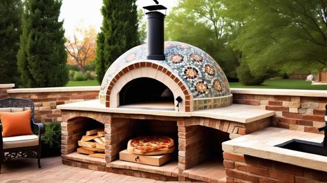 This backyard pizza oven is crafted with a combination of natural stone and brick, evoking the charm of a Mediterranean villa. The dome-shaped oven is adorned with intricate mosaic tiles, creating a visually stunning centerpiece. The wood-fired aspect adds authenticity to the cooking experience, imparting a delightful smoky flavor to the pizzas. Patio Pizza Oven Fireplace, Build A Pizza Oven Wood Burning, Outdoor Kitchen With Pizza Oven Ideas, Wood Fired Pizza Oven Design, Mosaic Pizza Oven Outdoor, Stone Oven Pizza, Outdoor Wood Fired Pizza Oven, Built In Pizza Oven Outdoor, Pizza Oven Mosaic