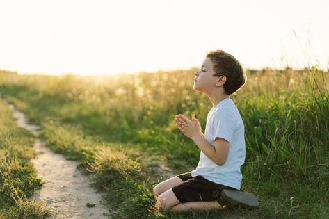 Premium Photo | Boy closed her eyes and praying in a field at sunset hands folded in prayer concept for faith spirituality and religion Field At Sunset, Classroom Background, Bible Images, Jesus Christ Art, Praying To God, Prayer Board, Her Eyes, Book Art Drawings, Premium Photo