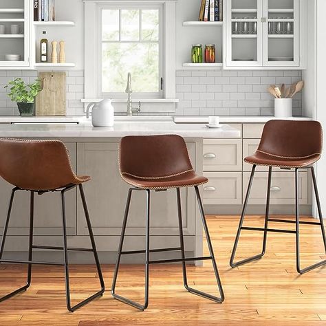 Luxuriate in HeuGah's 26-inch bar stools set of 3 with back, explicitly designed for your kitchen bar stools comfort. These counter height stools feature ergonomic backrest and footrest, ensuring relaxed kitchen chair seating. Built on a robust steel base that can withstand a weight of up to 300lb, our counter stools are designed for longevity. These brown stools for kitchen counter resist rust and bending, with foot pads that protect floors and ensure balance, even on uneven surfaces. Relaxed Kitchen, Barstools With Back, 30 Inch Bar Stools, Kitchen Island Counter, Brown Stool, Stools For Kitchen, Island Counter, Brown Bar Stools, Stools For Kitchen Island