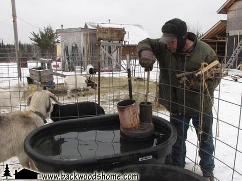 Build a wood-fired stock tank heater by Jackie Clay-Atkinson.  Tired of breaking the ice for your livestock each morning? Build this heater and save yourself the trouble! #JackieClay Stock Tank Heater, Large Stock Tank, Goat Shelter, Horse Water, Natural Farming, Fire Stock, Water Trough, Mini Cows, Diy Tank