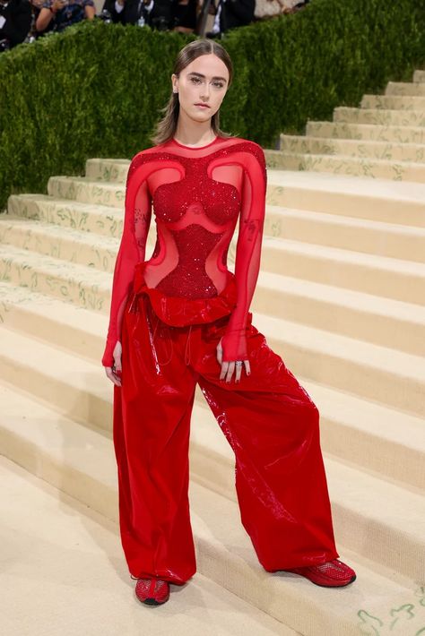 Trust Ella Emhoff to make baggy pants and sneakers look glamorous as ever. For her Met Gala debut, the second daughter and newly minted model wore head-to-toe Adidas by Stella McCartney, walking the red carpet in a diamond mesh bodysuit, oversize trousers, and sneakers all in the same shade of bright red. Though the cool, comfy vibe was classic Ella, the skintight top with glitter cutouts, which she accessorized with Cartier jewelry and a Stella McCartney purse, was unlike anything we've ever se Billie Eilish Met Gala, Ella Emhoff, A Lexicon Of Fashion, Gala Outfits, Met Gala Outfits, Gala Looks, 2021 Outfits, Met Gala Red Carpet, Met Ball