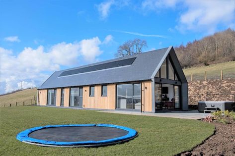 Modern Longhouse front of the house with trampoline Sunken Trampoline, Modern Timber Frame, Long House, Bungalow Design, Farm Buildings, St Andrews, Open Plan Living, 2 Bed, Architect Design