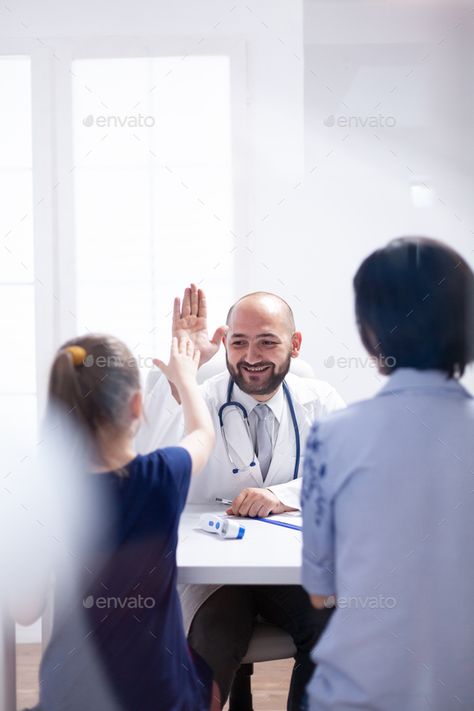 Doctor smiling at child by DC_Studio. Doctor smiling at child during consultation in hospital office. Healthcare physician specialist in medicine providing... #Sponsored #DC_Studio, #consultation, #hospital, #Doctor Surgeon Moodboard, Doctor Photoshoot Ideas, Medical Photoshoot, Clinic Photoshoot, Healthcare Photography, Hospital Photoshoot, Pediatrics Doctor, Doctor Photo, Hospital Office