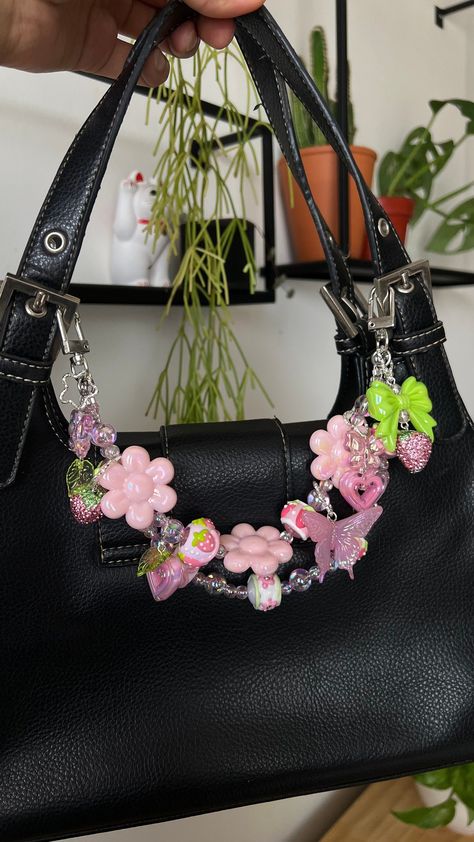 You don't need a new bag, you just need to charm! I created these chains to freshen up your old and new accessories, to personalize them and make them more unique to you!  Chain Length approx: shorter strap 11" , longer strap hangs 12"  + 6 handmade charms Colors: pink, green, white, silver  Materials, Metal, handcrafted beads, ceramic beads, plastic beads Collection: Strawberry Dew  Bag chains are not meant to hold weight but to decorate your accessories Bag Chain Beads, Personalized Bags Ideas, Bag Chains Accessories, Decorated Bags Aesthetic, Bags With Keychain, Cute Bag Keychains, Decorate Bag Ideas, Bag Chain Accessories, Purse With Charms