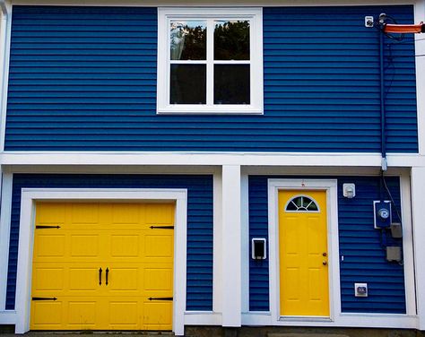 Yellow garage door house Yellow Garage Door, Colorful Garage Doors, Yellow And Blue House, Blue House Yellow Door, Blue And Yellow House, Door Color Ideas, Garage Door Colors, Garage Door House, Garage Door Paint