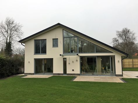 The asymmetric roof line and floor to ceiling shaped glazing makes this home a beautiful example of contemporary style. Asymmetrical Roof Architecture, Asymmetrical Roof Line, Asymmetric Roof, Austria House, Modern Cottages, Barn Houses, Self Build Houses, Self Build, House Roof Design