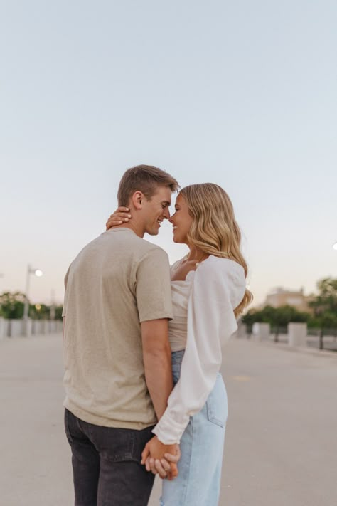 Tan And White Engagement Photos, Jumpsuit Couple Photoshoot, Couples Engagement Poses Photography, Couples At Weddings Guest Outfits, Engagement Poses Same Height, White Sweater And Jeans Engagement Photos, Couple Picture Ideas Casual, Serious Couple Photoshoot, Poses For Couples That Are The Same Height