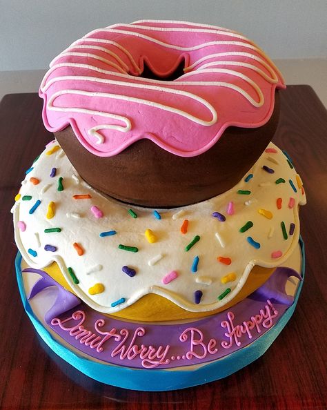 Cake Donut Decoration, Big Donut Cake, Cake That Looks Like Donut, Large Donut Cake, Donut Shaped Cake Birthday, Tiered Donut Cake, Donut Cake Ideas Birthday Parties, Cartoon Donut Cake, Donut Tier Cake