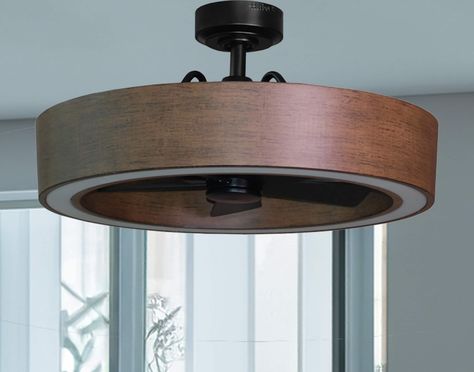 The 26-in Vanderbrook in black and walnut finish combines the style of a ceiling light along with the functionality of a ceiling fan making it a great option for your lighting and cooling needs. The Vanderbrook is equipped with a 6-speed remote control so you can maintain your ideal comfort level and a reversible motor function which allows you to change the direction of your fan from downdraft mode during the summer to updraft mode during the winter. The fan's integrated LED light kit is fully 1950 Lighting Fixtures, Office With Led Lights, Hidden Fan Light Fixture, Ceiling Fan In Kitchen Ideas, Fan Above Dining Table, Industrial Farmhouse Light Fixtures, Harbor Breeze Ceiling Fan, Masculine Bedroom Lighting, Living Room Fan Ideas