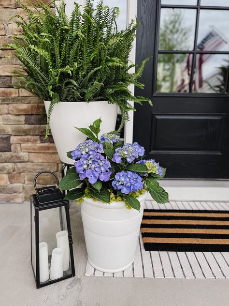 How to Style a Spring Front Porch - Life Love Larson Stoop Planter Ideas, Front Porch Hydrangeas Planters, Front Porch Container Plants, Flower Pots On Front Porch Steps, Potted Hostas Front Porches, Small Front Step Decor, Narrow Front Porch Decor, Front Porch Potted Plant Ideas, Front Step Decor