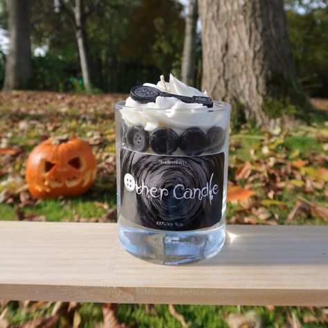 Transform your space with our enchanting Twitchy Witchy dessert candle, inspired by beloved fantasy films and whimsical adventures. Featuring a striking black marble base, this unique candle is adorned with layers of playful black buttons that spark curiosity and creativity. As you light the candle, indulge in the warm aroma of pumpkin spice, wrapping your home in a cosy embrace that's perfect for movie nights or autumn gatherings. Topped with a luscious swirl of whipped cream and a charming button-shaped key, this candle adds a touch of magic to any decor. Ideal for fans of whimsical storytelling and enchanting tales, our Twitchy Witchy candle makes a delightful gift for movie lovers and fantasy enthusiasts alike. Ignite your imagination and brighten your space with this captivating home Witchy Candle, Witchy Candles, Dessert Candle, Coraline Movie, Other Mother, Coraline Jones, Dessert Candles, Fantasy Films, Other Mothers