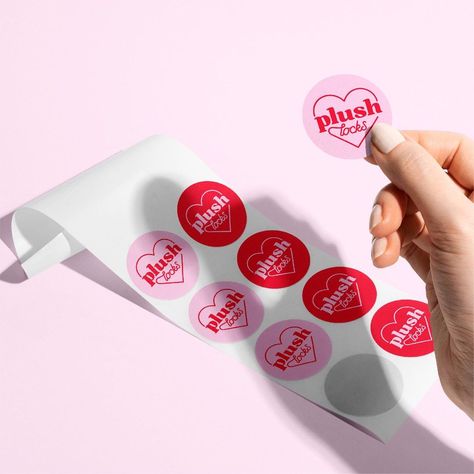 This sticker mockup features a colorful logo on a white background. It's perfect for showcasing your branding or product designs. stickermockup logomockup branding Pink And Red Logo Design, Pink Red Packaging, Pink And Red Packaging, Pink Red Branding, Pink And Red Branding, Logo Sticker Design, Heart Packaging, Red Logo Design, Heart Logo Design