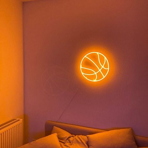 Bedroom neon sign Basketball Do you want a neon sign in your bedroom? But still don't know what sigh chose? Please welcome basketball neon. The sign of a ball for a basketball game. It is a bedroom neon sign that gives soft orange neon light. Neon light creates a warm and pleasurable atmosphere that gives romantic vibes. Such atmosphere prepossesses to long talks between loving people. This is a custom neon sign is perfect decoration and thing for a boy's or girl's room. Especially in the case w Basketball Game Signs, Basketball Vibes, Bedroom Neon Sign, Basketball Bedroom, Basketball Room, Bedroom Neon, Plexiglass Sheets, Basketball Background, Romantic Vibes