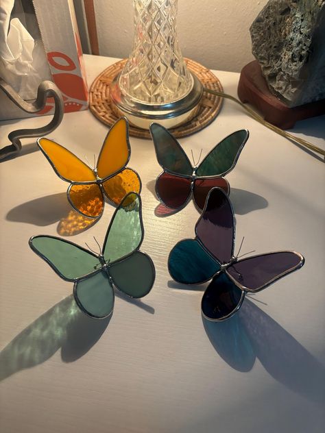 These gorgeous glass butterflies are handmade to order! Little legs are carefully soldered to allow these beautiful bugs to sit gracefully on any windowsill, shelf, desktop, table, or wherever you need a little pop of color.  Please reach out if specific glass is wanted! Otherwise, I will carefully select the glass that I think will look nicely together to complete your butterfly 🦋 Stained Glass Sculpture, Butterfly Stained Glass, Glass Butterflies, Diy Stained Glass Window, Stained Glass Night Lights, Butterfly Candles, Desktop Table, L'art Du Vitrail, Windowsill Shelf