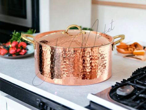 Introducing our exquisite Antique Copper Pot, handcrafted with utmost care and precision by two talented Moroccan craftsmen in the enchanting city of Fez. This magnificent piece showcases the rich traditions and artistry of Moroccan copperware. Dimensions 20 cm = 7.87 inch 25 cm = 9.84 inch 30 cm = 11.81 inch 35 cm = 13.77 inch 40 cm = 15.74 inch 45 cm = 17.71 inch 50 cm =19.68 inch ●Free gift  As a testament to our commitment to customer satisfaction, we offer free shipping on this product. Plu Vintage Copper Pots, Kalay, Copper Pans, Copper Cookware, Copper Pots, Cooking Pot, Soup Pot, Hammered Copper, Cooking Techniques