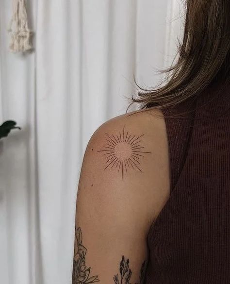 40 Gorgeous Shoulder Tattoos for Women - Body Artifact Sun Tattoo Around Elbow, Sun On Back Of Arm Tattoo, Flowers Elbow Tattoo, Sunburst Tattoo Shoulder, Sun Tattoo Shoulder For Women, Sun Woman Tattoo, Elbow Tattoo Sun, Sun Back Tattoo Women, Sun Tattoo Women