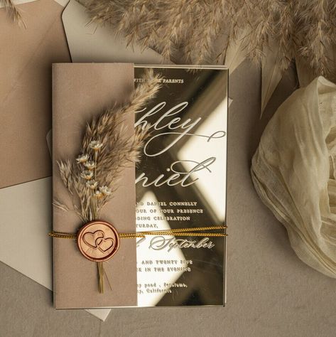 Your wedding invitations set the tone for your special day, and our Elegant Pampas Beige and Gold Mirror Wedding Invitations are designed to impress. These invitations are a perfect blend of sophistication and charm, ideal for an elegant garden wedding. Beige and Gold Mirror Wedding Invitations These stunning invitations feature a beige mirror finish that exudes luxury and elegance. The reflective surface adds a touch of glamour, making your wedding invitations stand out. The gold accents on th Classy Wedding Invitations Gold, Wedding Invitations Beige, Mirror Wedding Invitations, Wedding Invitations Brown, Brown And Gold Wedding Invitations, Cream And Gold Invitations, Gold Mirror Wedding, Beige Mirror, Rose Gold And Beige Wedding Invitations