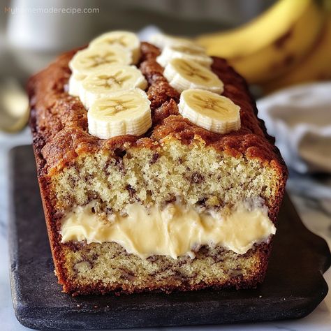 The Ultimate Cream Cheese Banana Bread takes the classic banana bread to the next level with a rich, creamy layer of sweetened cream cheese baked right into the center. This moist and tender bread is bursting with banana flavor, making it the perfect treat for any time of day. Whether enjoyed warm with a cup of coffee or as a delightful dessert, this banana bread is sure to become a favorite in your kitchen. Banana Moist Bread, One Sweet Mama, Banana Bread And Cream Cheese, Cream Cheese Banana Bread Recipe Moist, Banana Bread Cake With Cream Cheese, Banana Bread Cake With Cream, Amazing Banana Bread Cake, Baking Recipes With Cream Cheese, Banana Monkey Bread Recipe