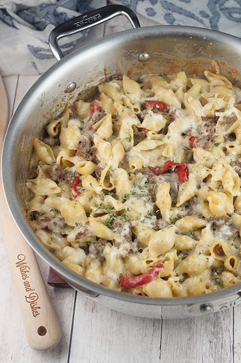 This easy dinner recipe for Philly Cheesesteak Pasta is a cheesy comfort food dish that will become a new family favorite! Philly Cheesesteak Pasta, Cheesesteak Pasta, Philly Cheese, Hot Italian Sausage, Homemade Hamburgers, Cheesy Pasta, Easy Dinner Recipe, Philly Cheesesteak, Philly Cheese Steak