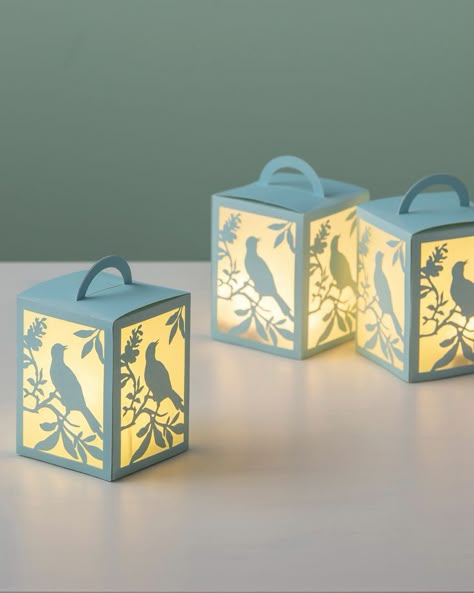 Set your home aflutter with these decorative paper lanterns inspired by nature. Diy Christmas Paper Decorations, Diy Christmas Paper, Cricut Projects To Sell, Lanterns Diy, Paper Lantern Decor, Paper Lanterns Diy, Paper Lantern Lights, Idee Cricut, Paper Christmas Decorations