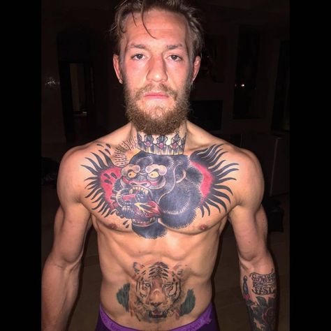 Conor McGregor's chest tattoo of a Gorilla King eating a heart and tiger tattoo on the stomach. Ufc Fighters Tattoo, Conor Mcgregor Tattoo, Fighter Tattoo, Gorilla Tattoo, Monkey Tattoos, Cool Chest Tattoos, Pieces Tattoo, Chest Piece Tattoos, Chest Tattoo Men