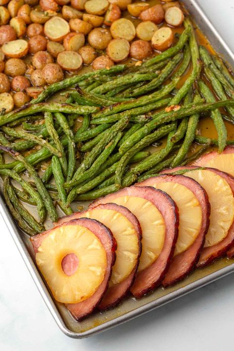 If you're planning a small holiday dinner for Easter, you are going to love this easy sheet pan pineapple ham and veggies. The ham and pineapple are glazed in a sweet and tangy sauce, and all of it cooks together on a sheet pan. It's easy to make and clean-up! Small Easter Dinner For 4, Clean Eating Easter Recipes, Christian Easter Dinner Ideas, Grown Up Snacks, Easter Fish Dinner Ideas, Easy Easter Finger Food Ideas, Cute Easter Food Ideas Appetizers, Small Christmas Dinner Ideas For 2, Easy Sheet Pan Recipes Healthy