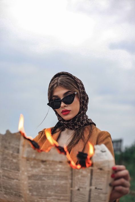 Newspaper, A Woman, Sunglasses