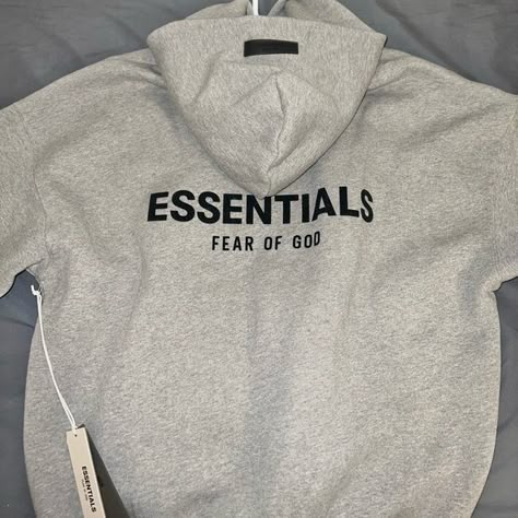 Essentials Hoodie Essential Hoodie Aesthetic, Gray Essentials Hoodie Outfit, Essentials Hoodie Aesthetic, Essential Hoodie Outfit, Vintage Hoodies Aesthetic, Grey Essentials Hoodie, Essentials Hoodie Outfit, Fear Of God Sweatshirt, Grey Graphic Hoodie