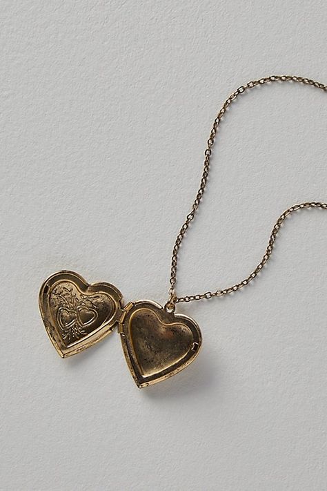 A super sweet gift or an accessory unique to you, this darling monogram necklace features a heart locket pendant with an initial engraving. **Features:** Dainty chain, heart locket pendant, hinge opening mechanism, monogram initial engraving, clasp closure **Why We | Monogram Necklace by Free People in Gold Birthday Gifts Sentimental, Small Gem Necklace, Heart Locket Necklace Gold, Jewelry With Initials, Gold Heart Shaped Locket, Meaningful Goodbye Gifts, Good Heart Necklace, Handmade Unique Jewelry, Dainty Gold Locket