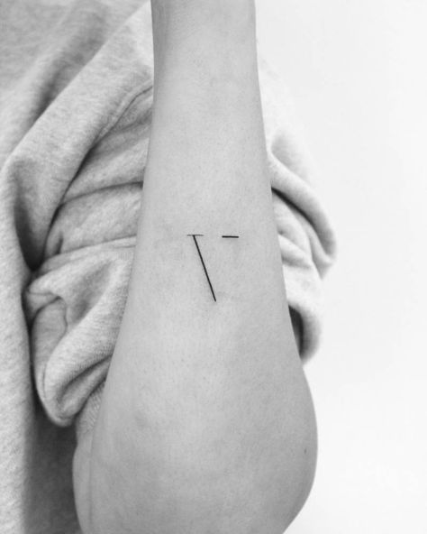 Minimalistic letter "V" tattoo for her son. V Letter Tattoo Designs For Women, Small V Tattoo, Initial V Tattoo, V In Different Fonts, V Tatoos Letter, Minimalist Initial Tattoo, Letter F Tattoo Ideas, X Tattoo Letter, V Initial Tattoo