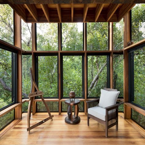 The bedroom/living space is enclosed by large glass windows framing the treescape. “I think one of the most successful experiential aspects of a building is how intimately involved it is with the site,” says architect Ant Vervoort. “An expensive view has the effect of divorcing one from the site. In House of the Tall Chimneys, the views are very close and intimate, which makes you part of the site.” The timber used throughout is Eucalyptus saligna, which is native to Australia and sustainably gr Pnw Design, Brick Crafts, Wilderness Retreat, Brick Chimney, Retreat Center, Cabin Interiors, Timber Structure, Window Ideas, Cabinetry Design