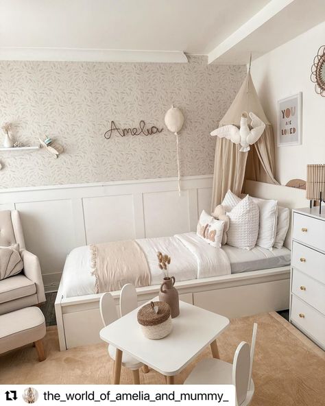 What a stylish bedroom makeover!   Take a look at Amelia's stunning bedroom, where we've helped bring the design vision to life with our custom-cut shaker panelling kit with dado rail. Painted in Dulux's Pure Brilliant White in a matt finish, the panelling adds a crisp, clean look that complements the soft, neutral tones of the room. Girls Bedroom Panelling Ideas, Panelling Girls Bedroom, Half Wall Paneling Ideas Nursery, Kids Bedroom Panelling, Kids Room Panelling, Girls Bedroom Panelling, Nursery Wall Paneling, Girls Neutral Bedroom, Nursery Panelling