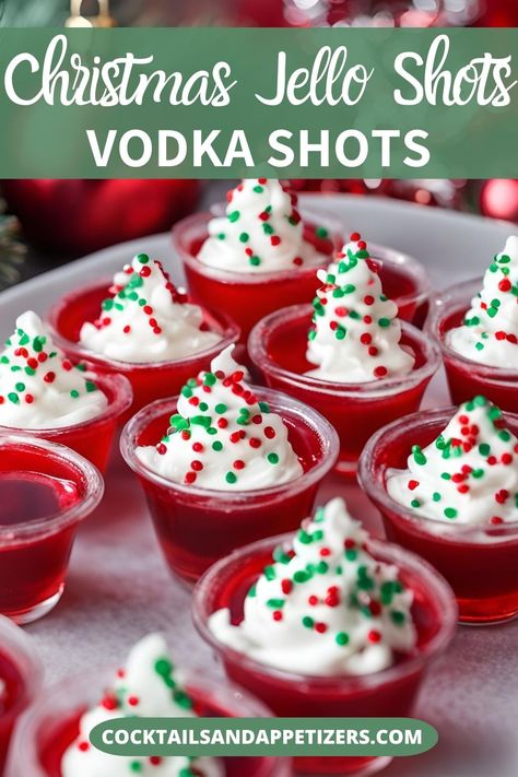 Pretty Christmas Jello shots for your holiday party! Easy to make jello shots made with vodka and cherry jello, topped with whipped cream and holiday sprinkles. Christmas Alcoholic Jello Shots, Red And Green Jello Shots, Santa Jello Shots, Christmas Jello Shots Vodka, Festive Jello Shots, Jell-o Shots Christmas, Christmas Fun Food Ideas, Xmas Jello Shots, New Years Jello Shots Recipe