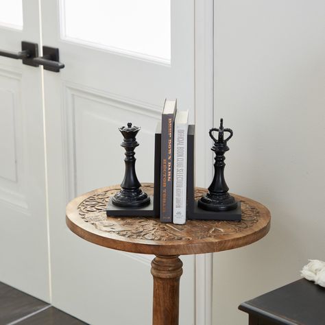 "Find the 8\" Black Chess Bookends, 2ct. at Michaels. com. Transform your rustic and traditional-inspired bookshelves at home and in your office with the addition of this King and Queen chess piece bookend pair! Transform your rustic and traditional-inspired bookshelves at home and in your office with the addition of this King and Queen chess piece bookend pair! This impressive home library/office décor set is made of polystone in a textured finish and L-shaped panels. Details: Black 5\" x 8\" 2 Home Libraries, Unique Bookends, Queen Chess Piece, Law Office Decor, Chess Queen, Decorative Bookends, Chess Table, Dark Academia Decor, Study Area