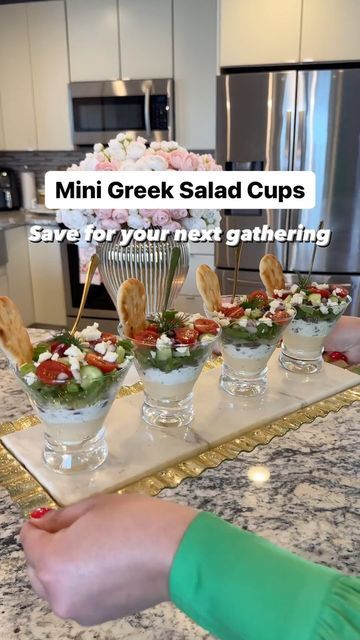 Reina G. Slim on Instagram: "Mini Greek Salad Cups 🥗 What you will need 👇🏻

Rather than the usual Greek Salad in a big bowl, why not layer in a clear cup when hosting? Not only they look so amazing and delicious but they sure will wow your family and friends when entertaining! Here’s what you will need: 👇🏻

Ingredients:
▫️Hummus (Classic ) @cedarsfoods 
▫️Tzatziki sauce @cedarsfoods 
▫️Kalamata olives (sliced)
▫️Marinated Artichokes (sliced) 
▫️Romaine lettuce (shredded) 
▫️Cucumbers ( diced)
▫️Cherry tomatoes (halved)
▫️Red onions (diced) 
▫️Feta cheese (crumbled)
▫️Fresh dill for garnish (optional) 
▫️Mini Naan dippers @stonefirenaan 

▫️Clear disposable cups ( I didn’t have any on hand that’s why I used glass)
▫️Mini appetizer forks

Follow along to see how I prepared these heavenl Greek Salad Cups, Mini Salads In A Cup, Hummus Cups, Naan Dippers, Hummus Cup, Mini Naan, Mini Salad, Salad Cups, Marinated Artichokes