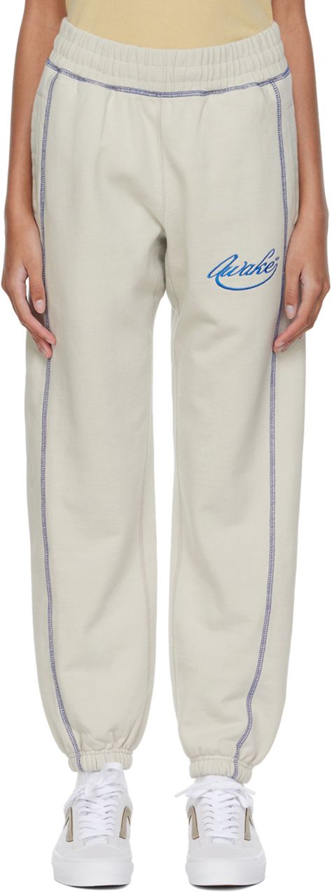 Find AWAKE NY Off-white Cotton Lounge Pants on Editorialist. French terry lounge pants. Contrast overlock stitching throughout. · Concealed drawstring at elasticized waistband · Logo embroidered at front · Three-pocket styling · Elasticized cuffs Supplier color: Cream White Sweatpants Outfit, Off White Sweatpants, Sweat Suits Outfits, Awake Ny, Logo Pants, Cream Pants, Sweatpants Outfit, Pant Trends, Pants Details