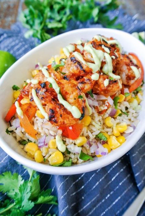 This shrimp dish combines lean protein with all the veggies over delicious rice. Our mouths are watering already!  Get the recipe from Kelly's Ambitious Kitchen » Shrimp Burrito Bowl, Shrimp Burrito, Shrimp Bowl, Chipotle Shrimp, Easy Rice, Healthy Rice, Ambitious Kitchen, Shrimp Dinner, Rice Bowls Recipes