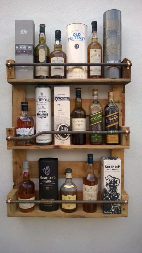 Scrap lumber + scrap pipe + copper clips = Wall bar Pallet Whiskey Rack, Hanging Liquor Shelf, Liquor Shelf Diy, Diy Liquor Shelf, Whiskey Shelf Ideas, Liquor Shelf Ideas, Nice Shelves, Masculine House, Whiskey Shelf