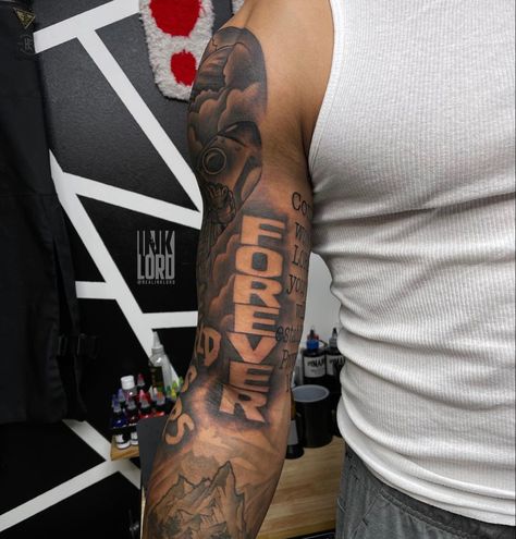 Mens Tattoos Sleeves Ideas, Tattoo Ideas For Men Inside Bicep, Fear God Shoulder Tattoo, Back Of The Bicep Tattoo, Bicep Tattoo Men Sleeve, Rasta Tattoo Men, Behind Arm Tattoo For Men, Tattoos For Guys Bicep, Foe Tattoos Men