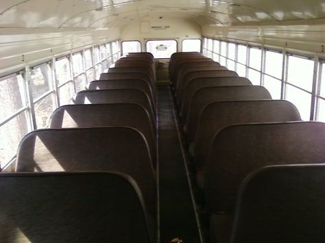 (This link will be useful, too) Keep two seats in the front on the wall with no door, except make them face each other, re-upholster them to match the rustic style, and put a simple wood table in between that matches the planned kitchen counter-tops. Seat Bus, Converted Bus, Bus Interior, Bus Living, Folding Seat, School Bus Conversion, Bus House, Bus Life, Magic School Bus