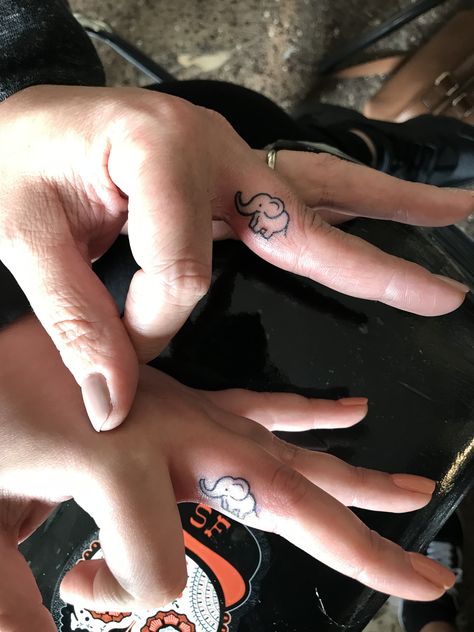 Mother daughter matching tattoos Small elephant tattoo Finger tattoo Mother Daughter Matching Tattoos, Elephant Finger Tattoo, Little Elephant Tattoos, Small Elephant Tattoo, Tattoo Finger, Finger Tats, Elephant Tattoo Design, Stylish Tattoo, Inspiration Tattoos